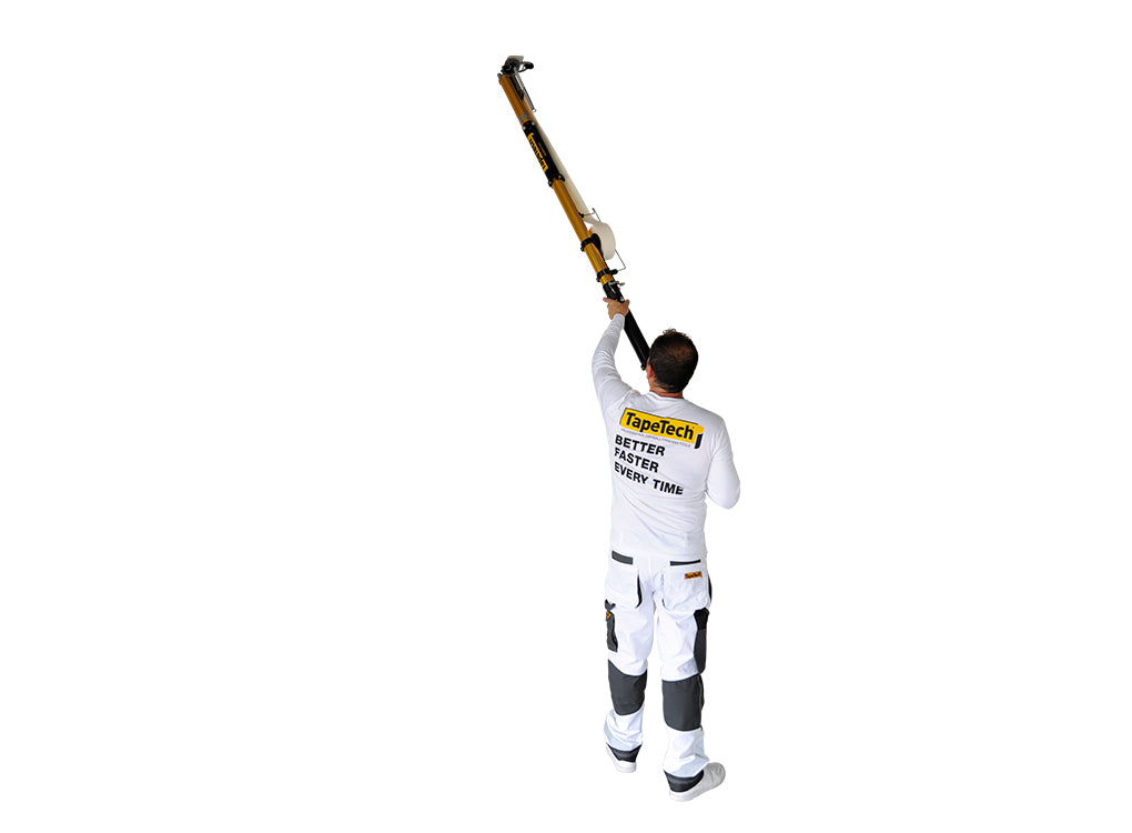Worker using TapeTech 07TT EasyClean Automatic Taper with extension for overhead taping