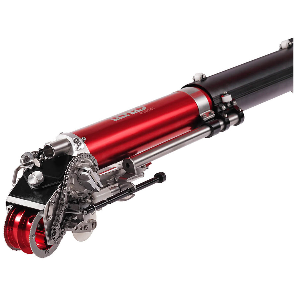 Close-up of Level 5 Automatic Taper head with a red and black billet aluminum body, steel components, and white creaser wheel, right side