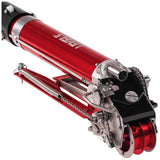 Close-up of Level 5 Automatic Taper head with a red and black billet aluminum body, steel components, and white creaser wheel, left side